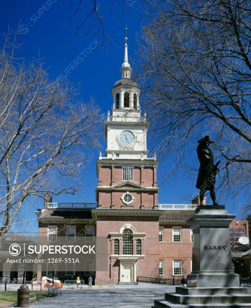 Statue in front of a clock tower, Independence Hall, Independence National Historical Park, Pennsylvania, USA