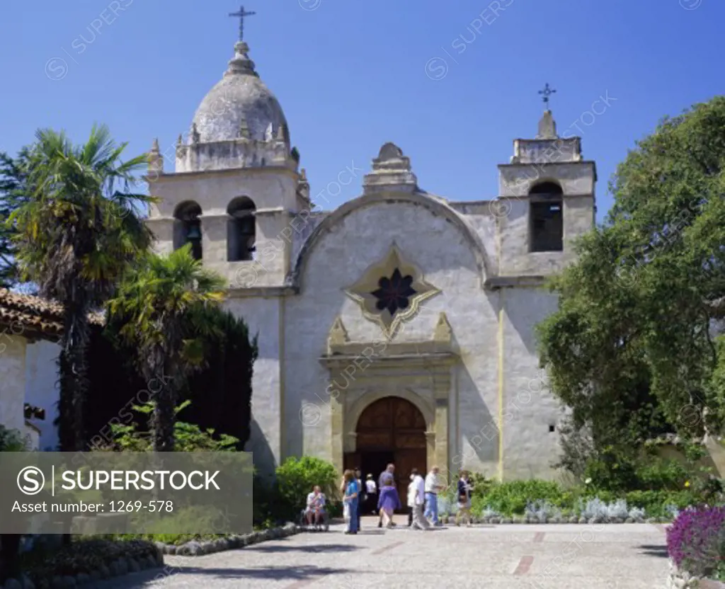 Tourists standing in front of a church, Mission San Carlos Borromeo de Carmelo, Carmel, California, USA