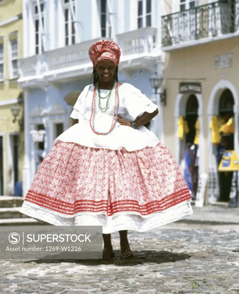 Portrait of a young woman wearing traditional clothing and smiling, Salvador, Brazil