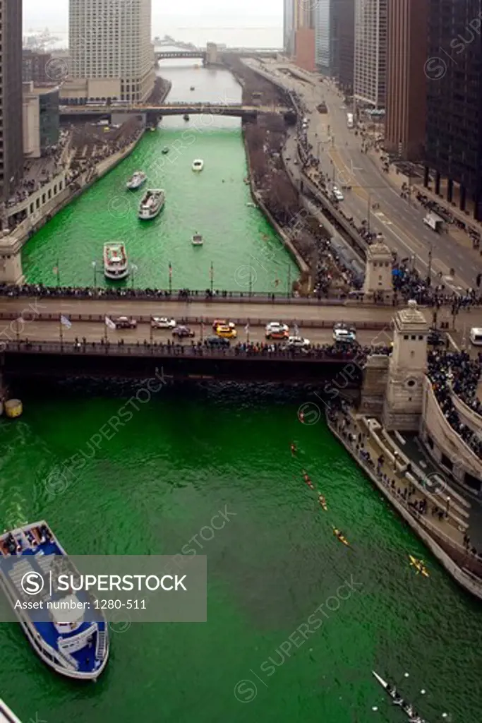 Boats on the dyed green Chicago River, DuSable Bridge, Wacker Drive, Chicago, Cook County, Illinois, USA