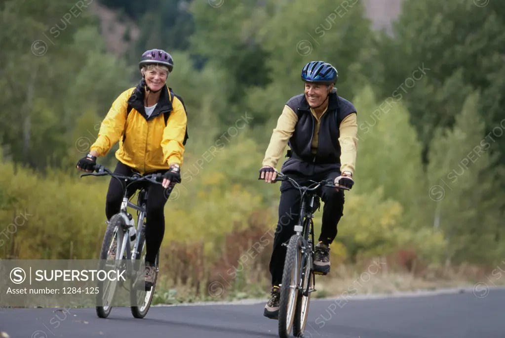 Senior couple riding bicycles together