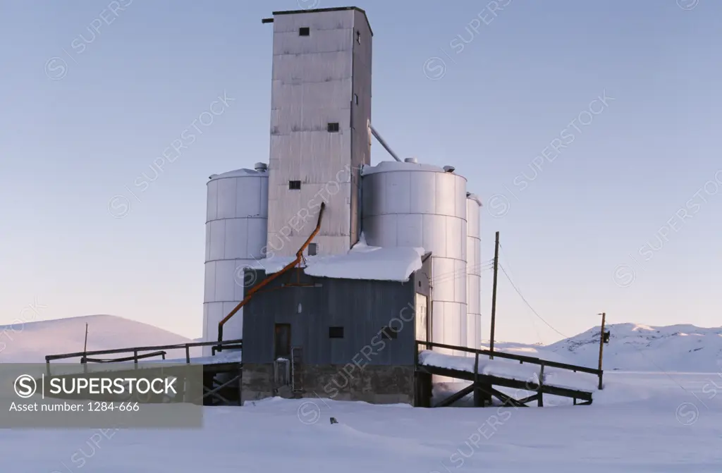 Silo in a snow covered field,  Idaho,  USA