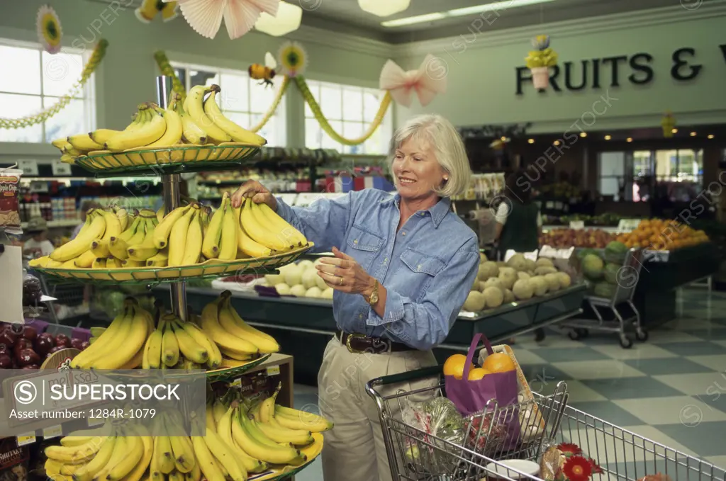 Senior woman shopping in a grocery store