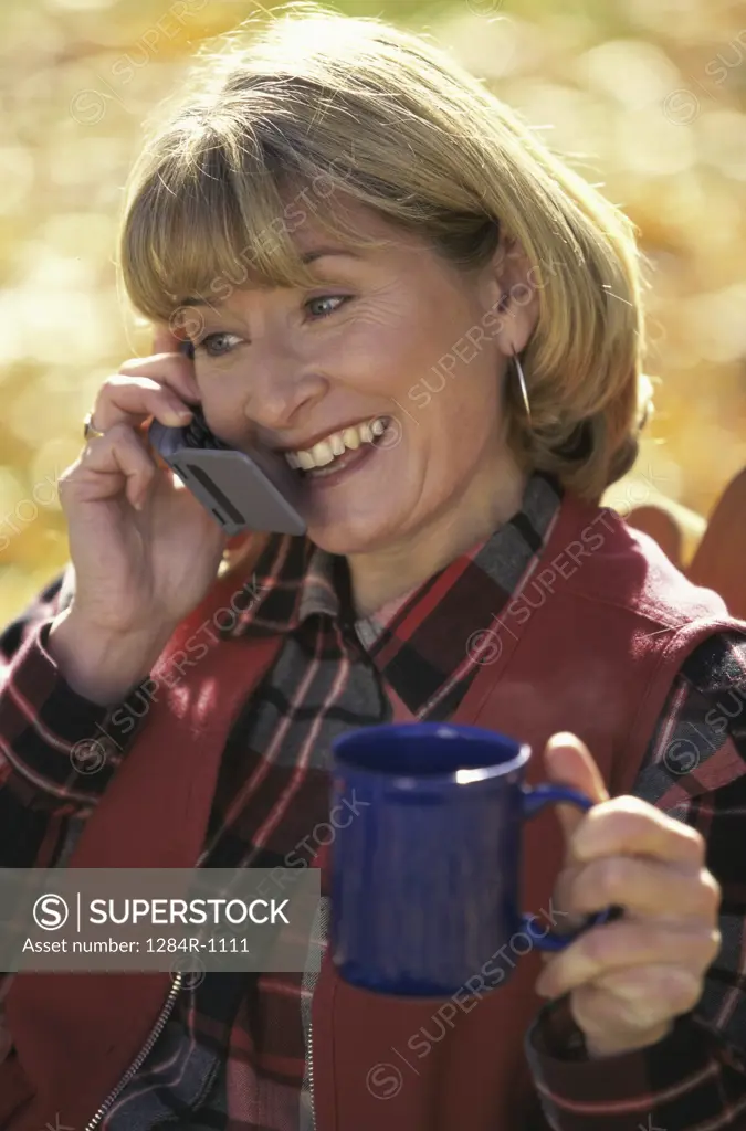 Mid adult woman talking on a mobile phone