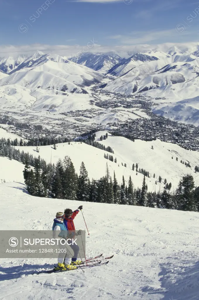 Couple skiing on Bald Mountain, Sun Valley, Idaho, USA