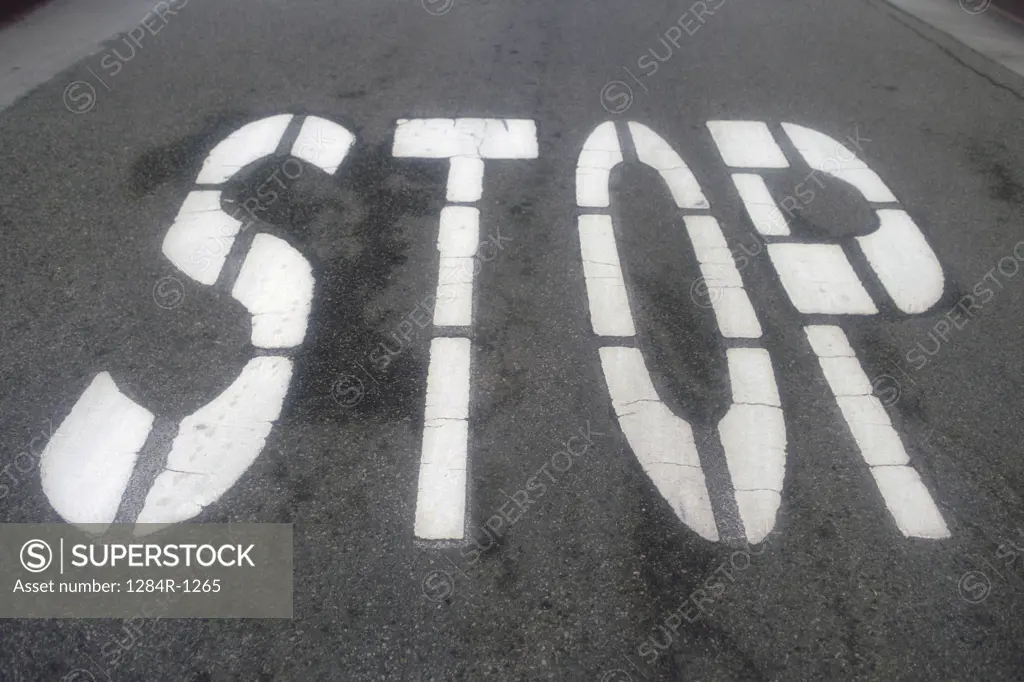 Stop sign painted on a road