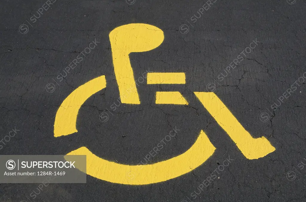 Handicapped sign painted on a road