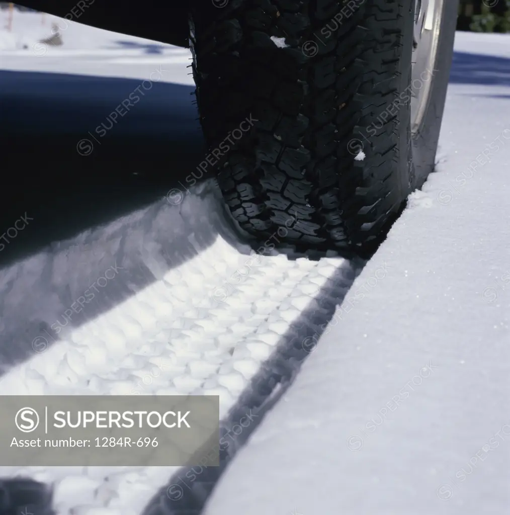 Close-up of a tire in snow