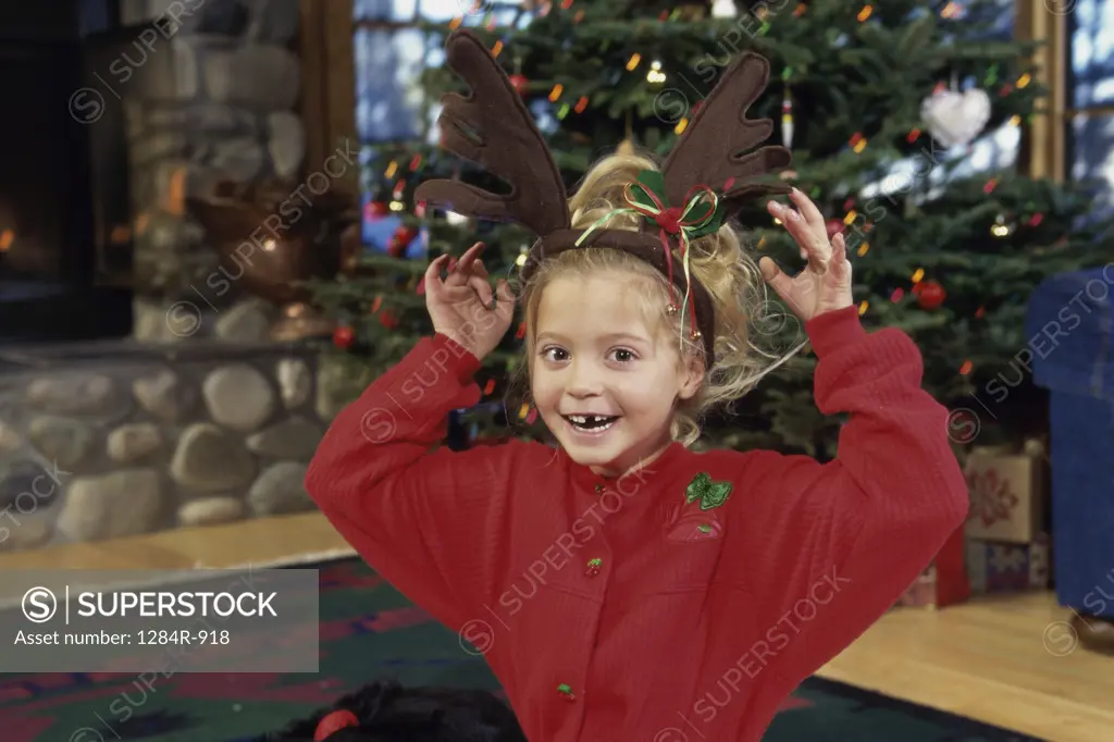 Portrait of a girl wearing fake antlers