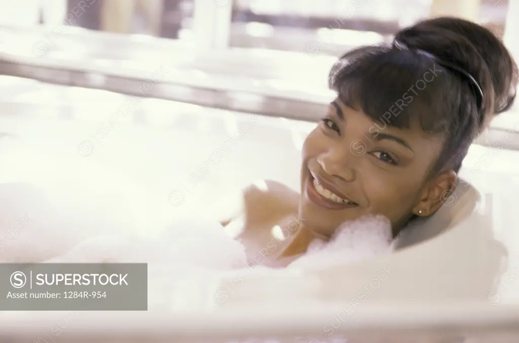 Portrait of a woman relaxing in a bathtub
