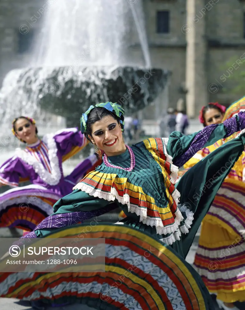 Portrait of three young women dancing, Guadalajara, Jalisco, Mexico