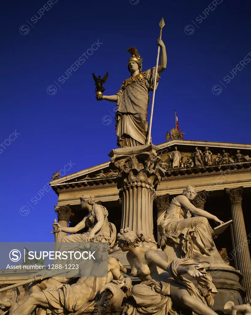 Low angle view of statues in front of a government building, Parliament Building, Vienna, Austria