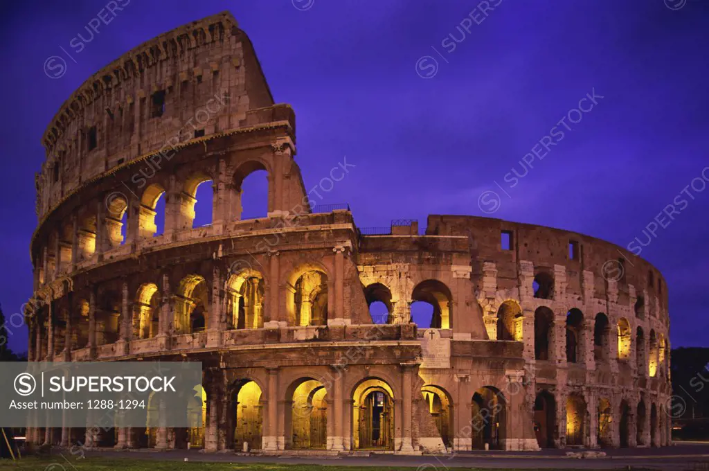 Low angle view of a coliseum lit up at night, Colosseum, Rome, Italy