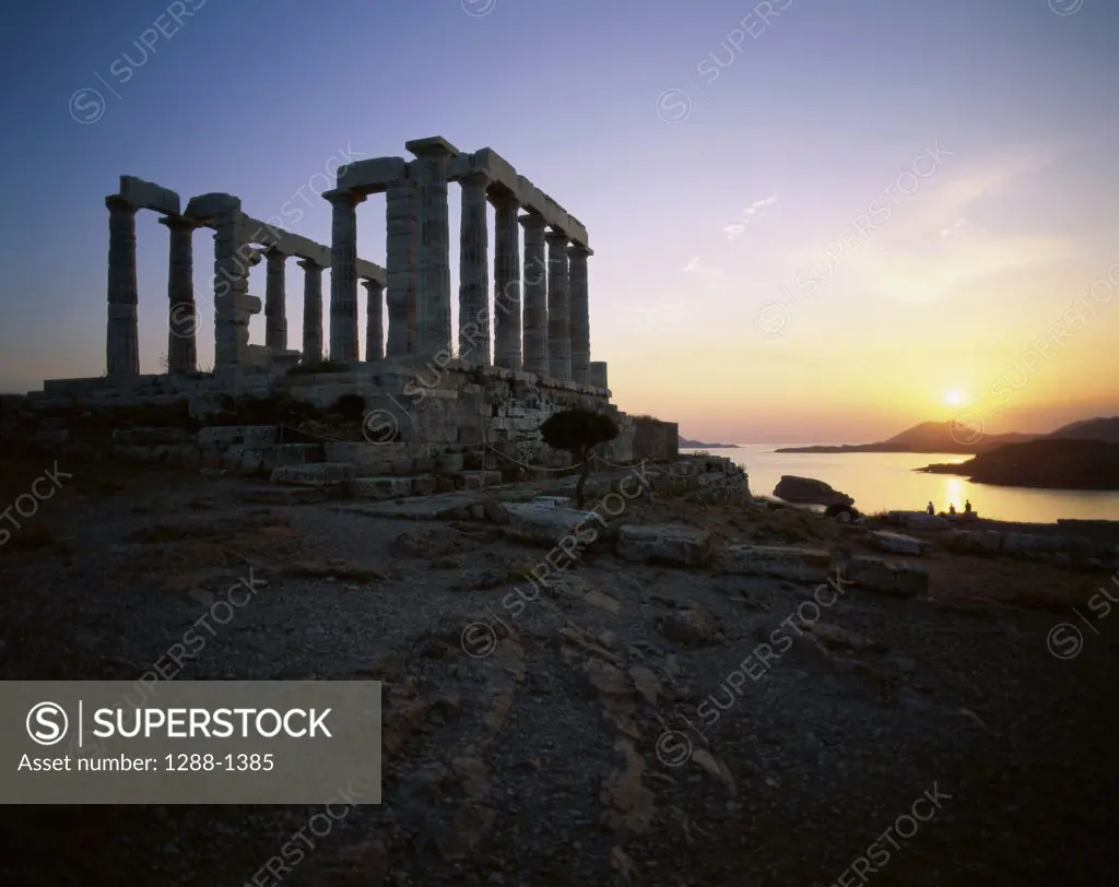 Low angle view of a temple at sunset, Temple of Poseidon, Sounion, Greece