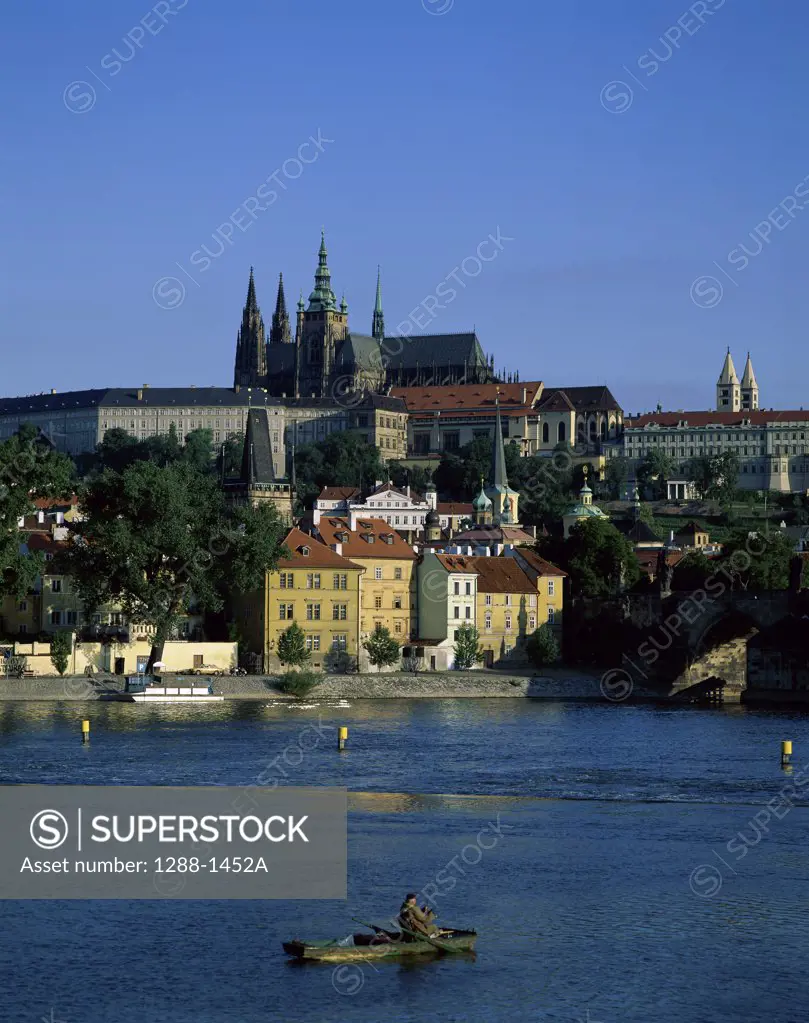 Buildings on the waterfront, St. Vitus Cathedral, Hradcany Castle, Vltava River, Prague, Czech Republic