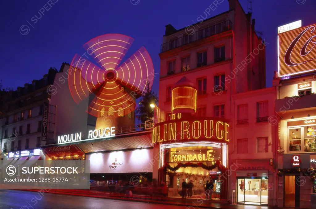 Buildings lit up at night, Moulin Rouge, Paris, France
