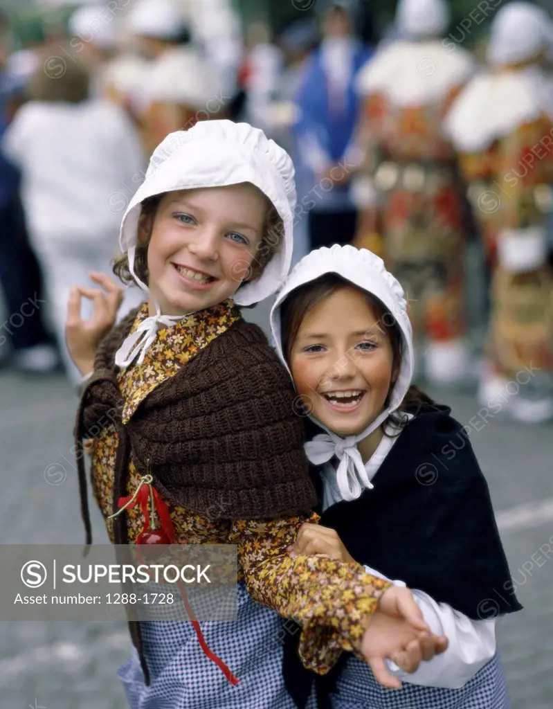 Two girls dressed in traditional attire, Belgium