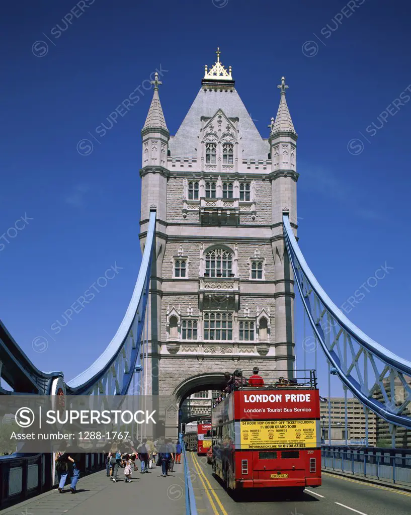 Open-air buses moving on a bridge, Tower Bridge, London, England