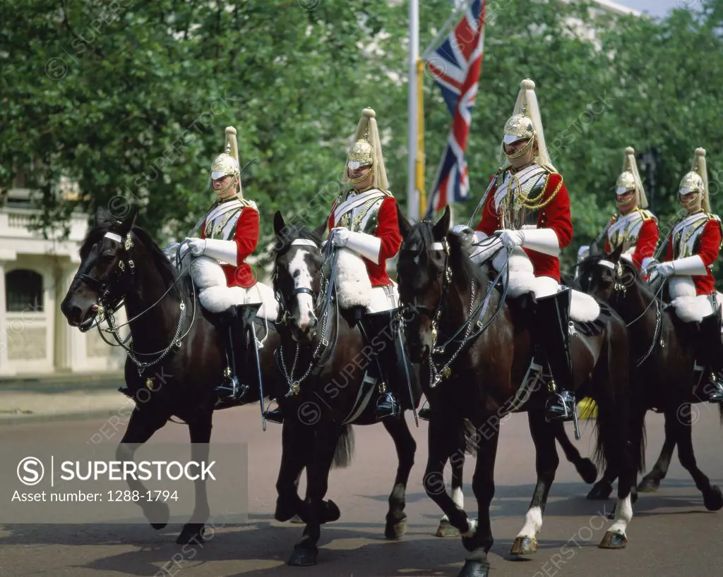 Group of horse guardsmen riding horses, London, England