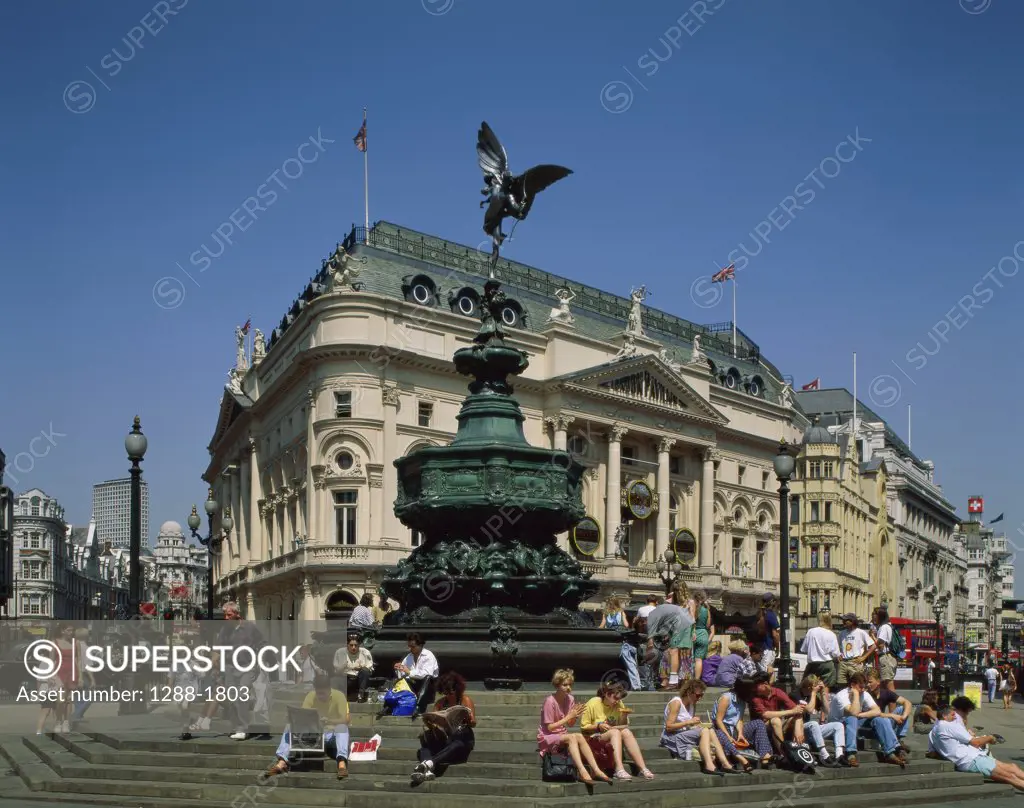 Low angle view of a statue in front of building, Statue of Eros, Piccadilly Circus, London, England