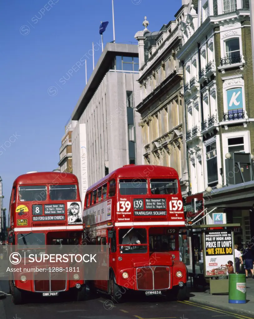 Two buses moving on a road, Oxford Street, London, England