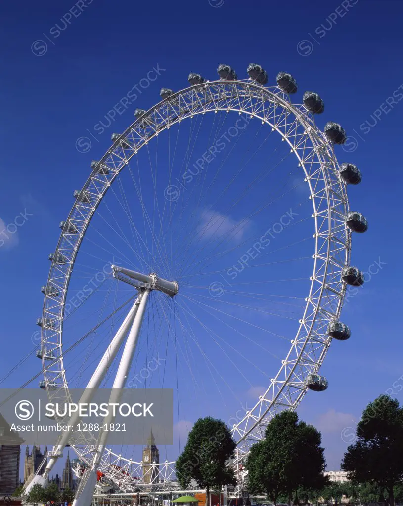 Low angle view of a ferris wheel, London Eye, London, England