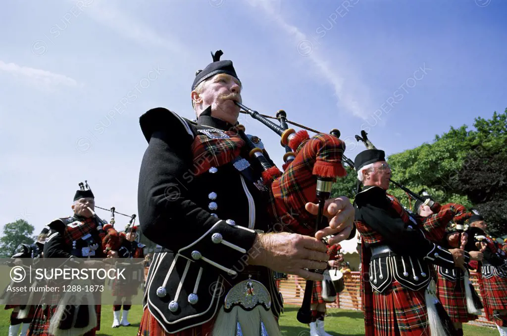 Bagpipers playing in a band, Scotland