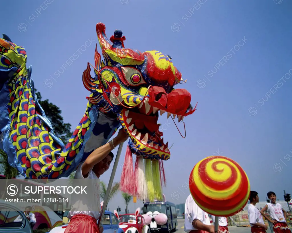Low angle view of Chinese dragon dancing, Hong Kong, China