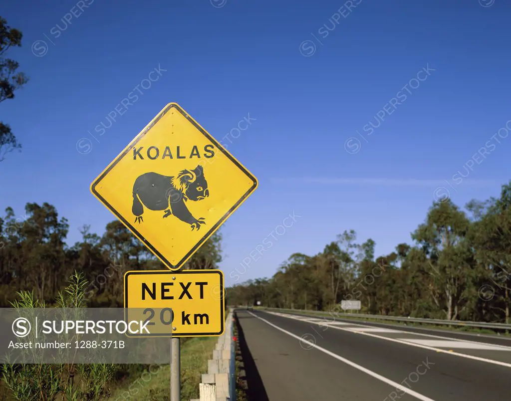 Close-up of animal crossing sign on a roadside, Queensland, Australia