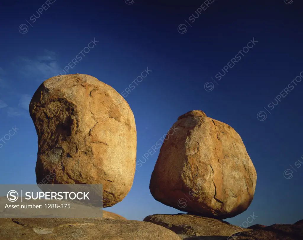 Low angle view of two rocks, Devil's Marbles, Northern Territory, Australia