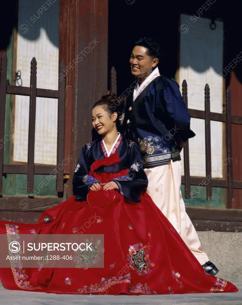 Young couple dressed in traditional wedding clothing, South Korea
