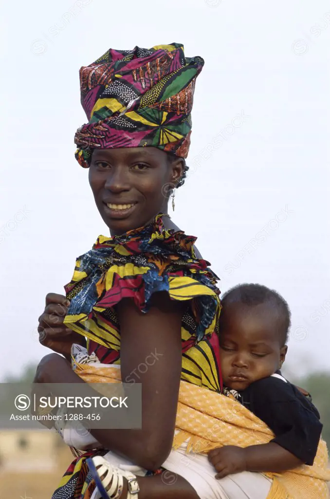 Portrait of a mother carrying her child, Banjul, Gambia