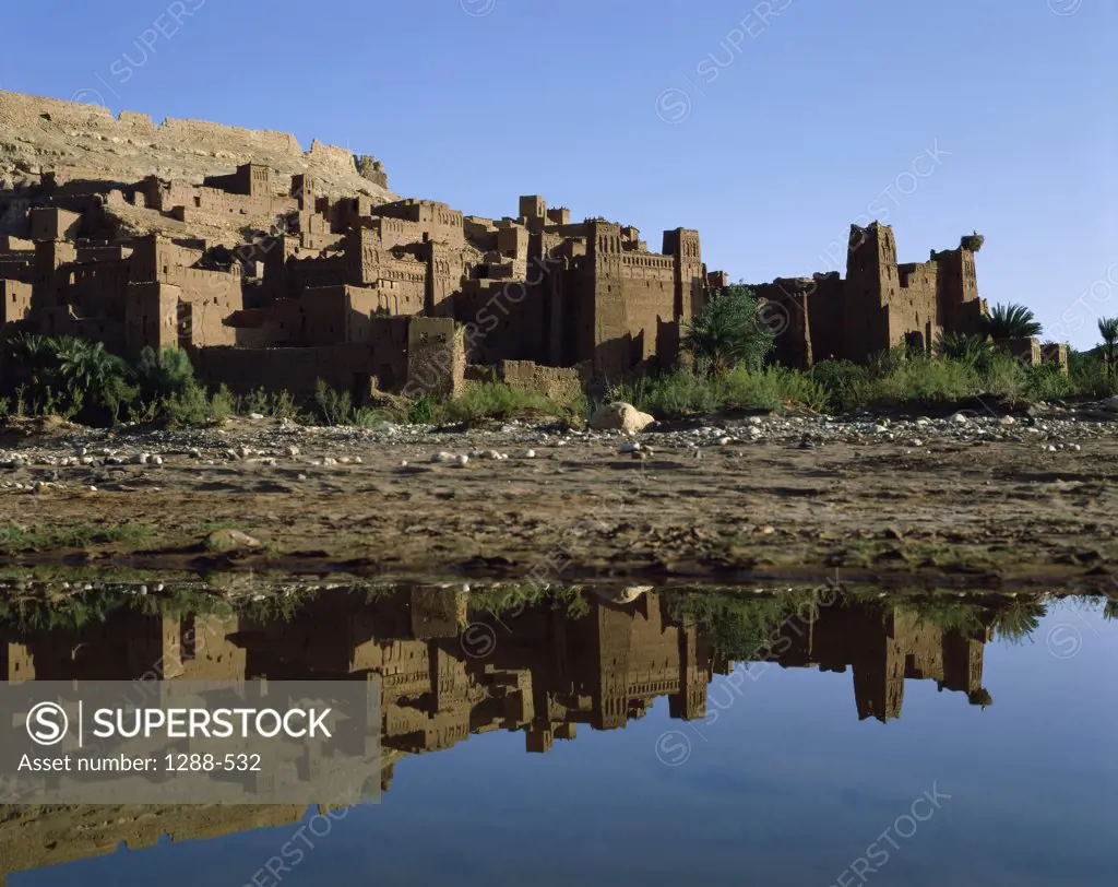 Reflection of old ruins in water, Casbah, Ait Benhaddou, Morocco