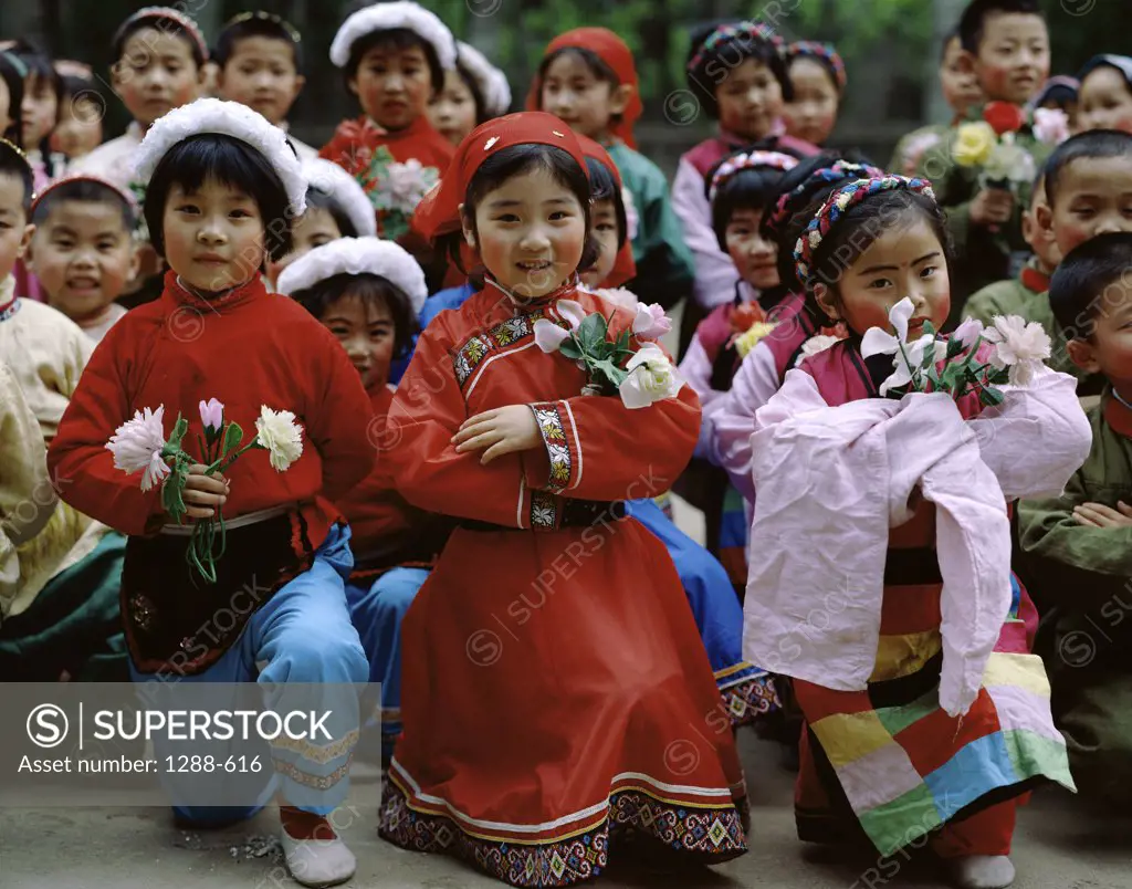 Children wearing traditional clothing, China