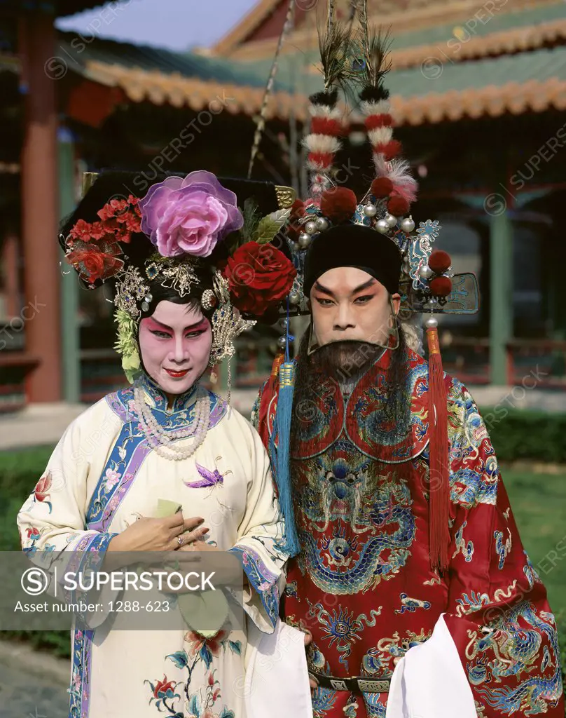 Portrait of two opera performers in traditional clothing, China
