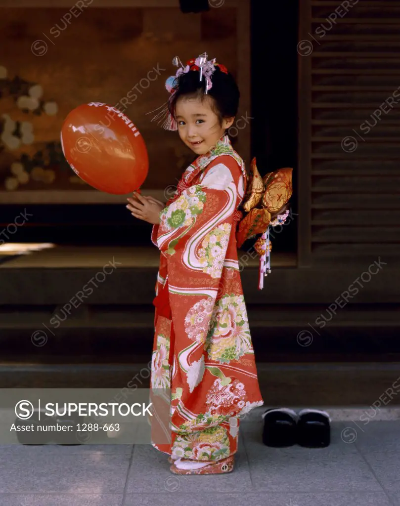 Portrait of a girl holding a balloon, Japan