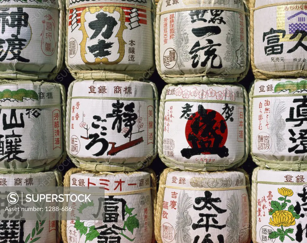 Close-up of saki barrels in a store, Japan