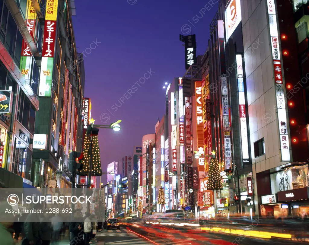 Commercial buildings lit up at night, Shinjuku Ward, Tokyo, Japan