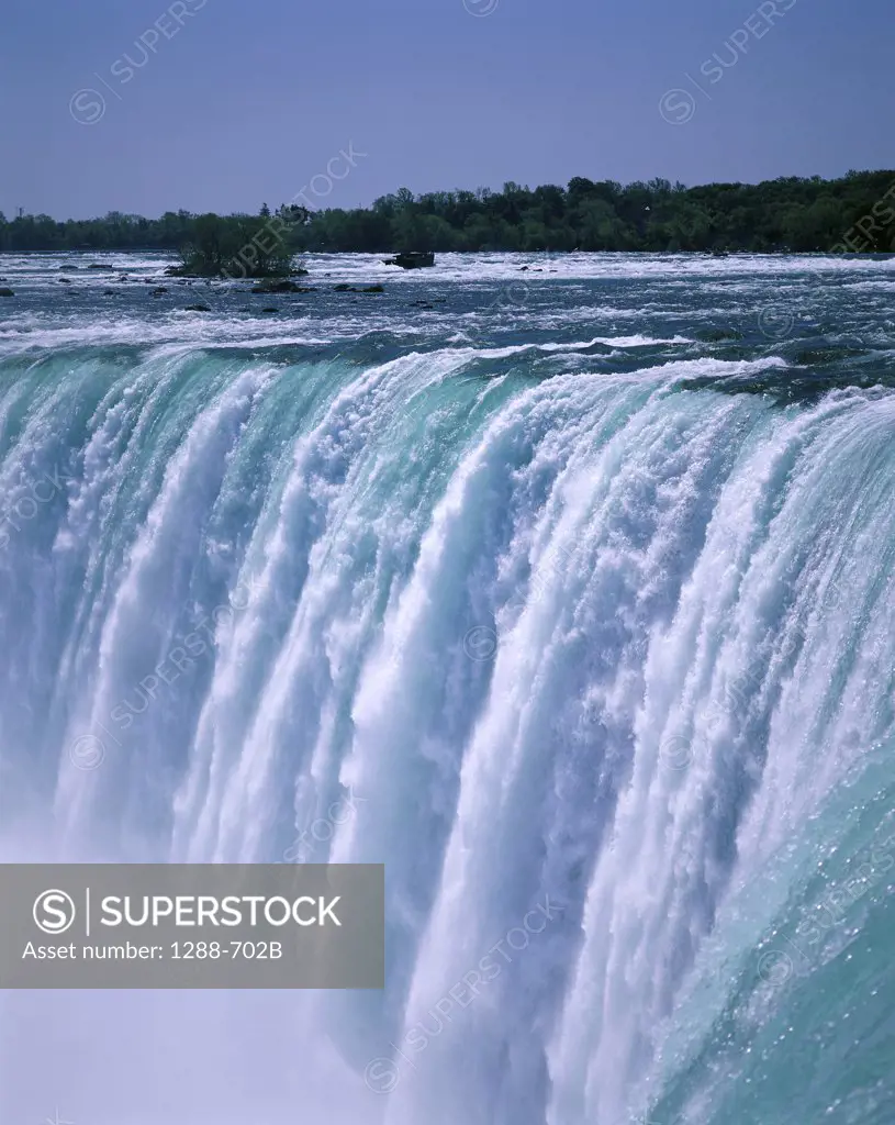 Water flowing over Niagara Falls, Ontario, Canada