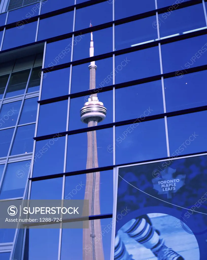 Reflection of a tower in a glass building, CN Tower, Toronto, Ontario, Canada