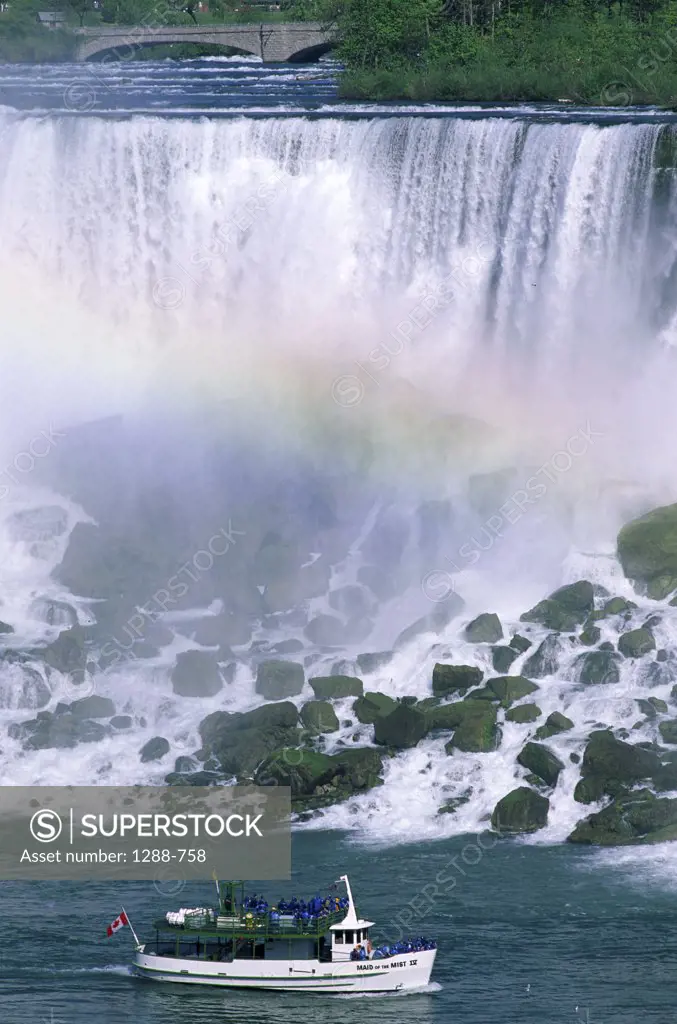 Boat in front of a waterfall, American Falls, Niagara Falls, New York, USA