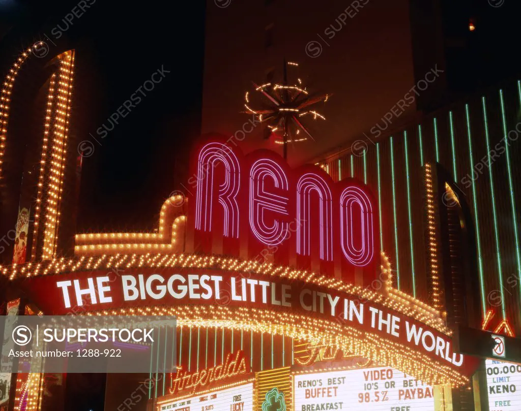 Low angle view of a welcome sign lit up at night, Reno, Nevada, USA