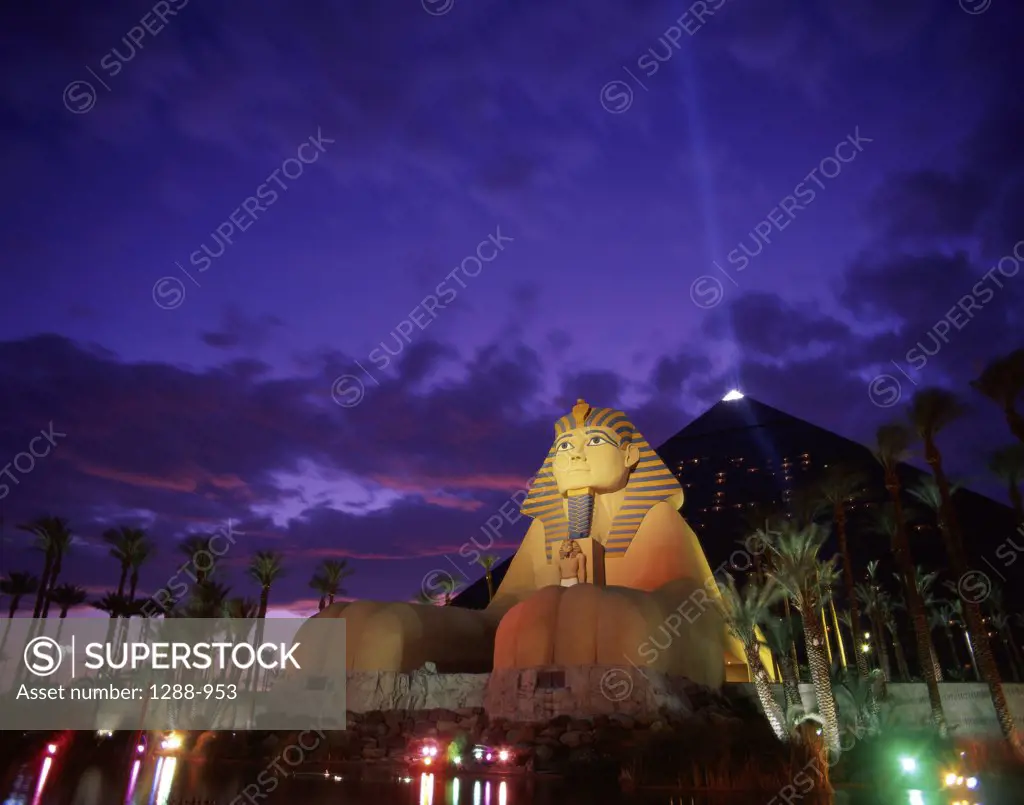 Low angle view of a hotel lit up at dusk, Luxor Hotel Casino, Las Vegas, Nevada, USA