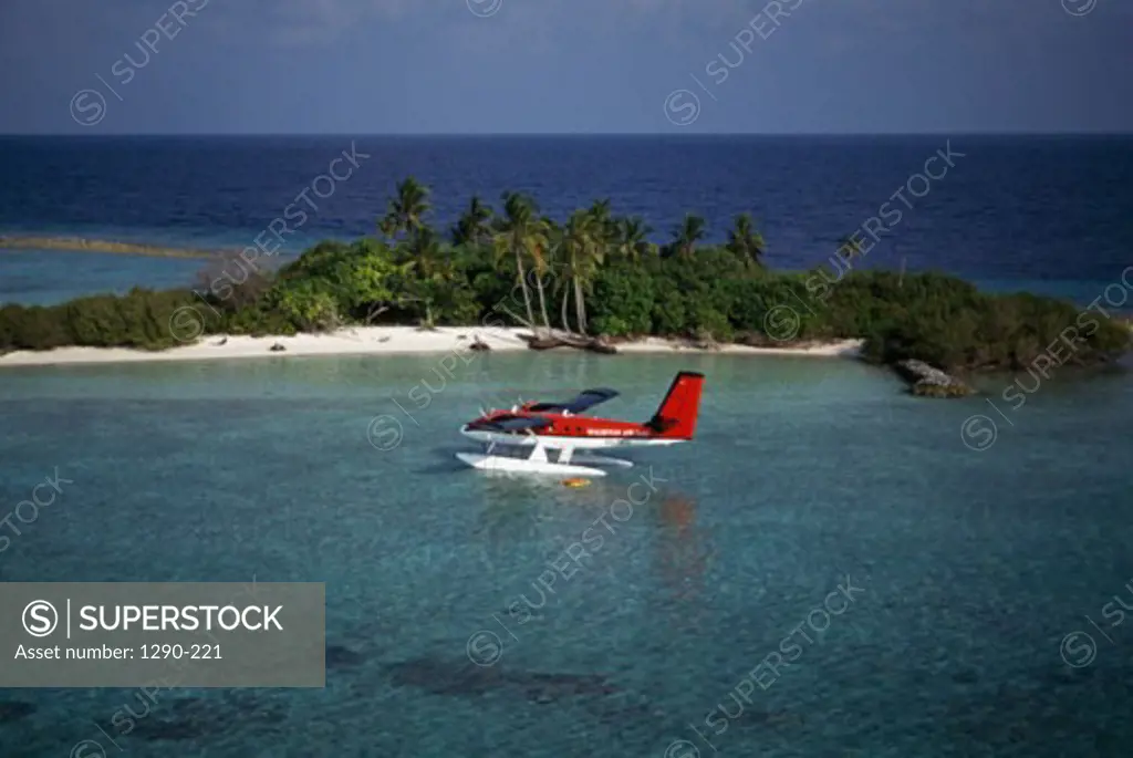 Aerial view of a seaplane near an island in the ocean, Maldives