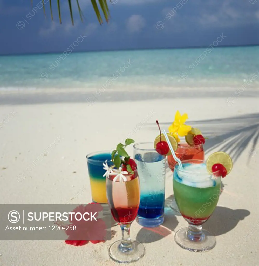 Close-up of cocktails on the beach