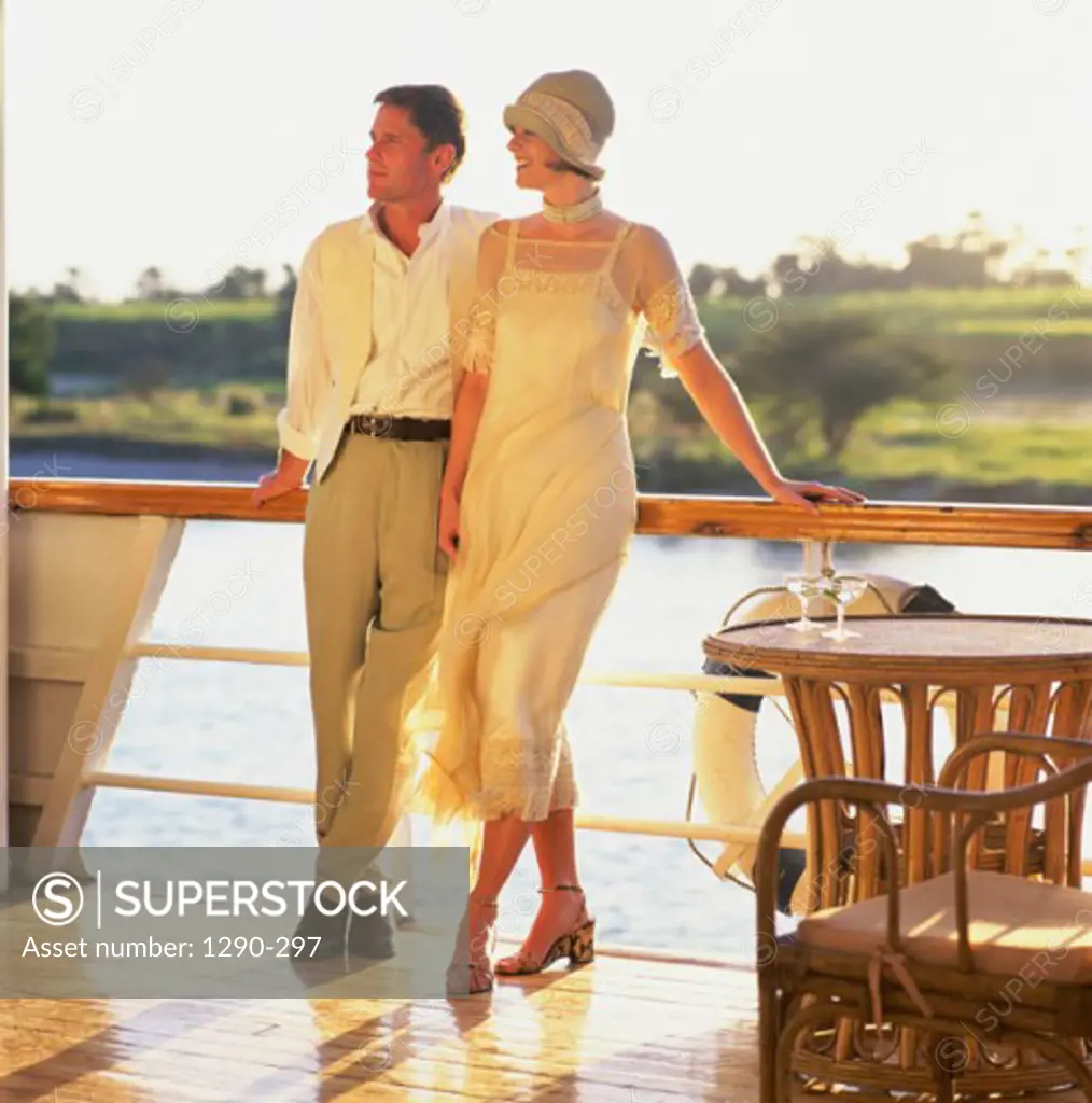 Young couple standing together on the deck of a cruise ship, Nile River, Egypt