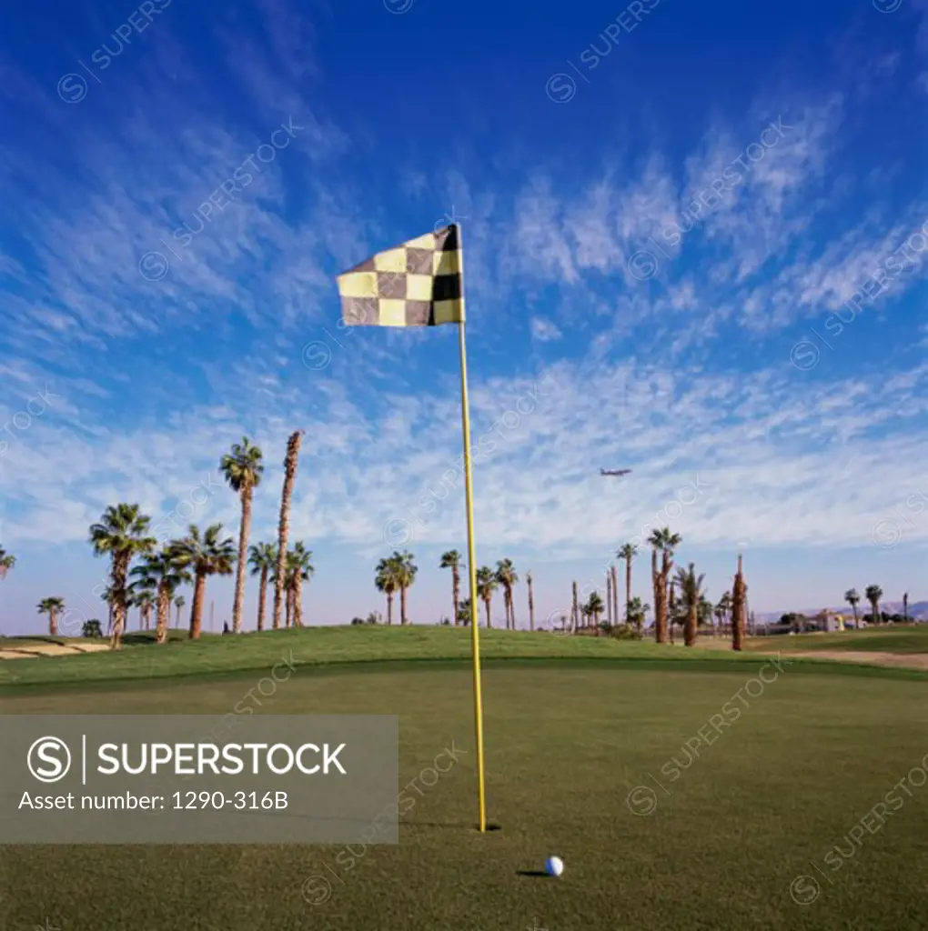 Golf flag and a golf ball in a golf course, Luxor, Egypt