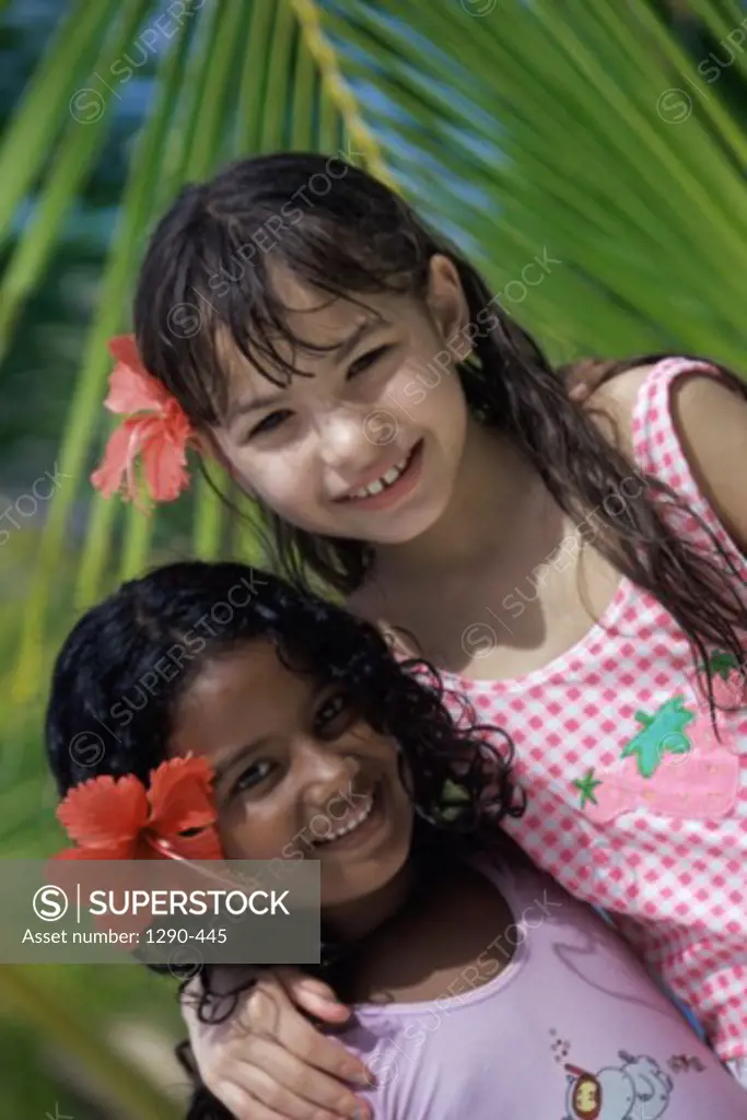 Portrait of two girls smiling, Maldives