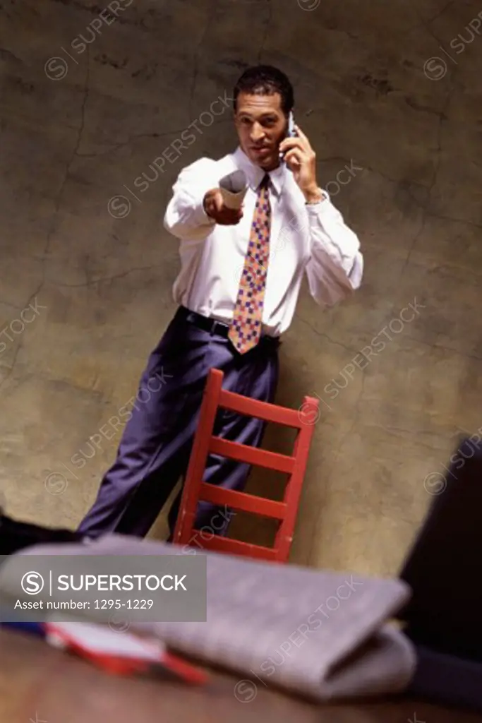 Portrait of a young businessman talking on a mobile phone