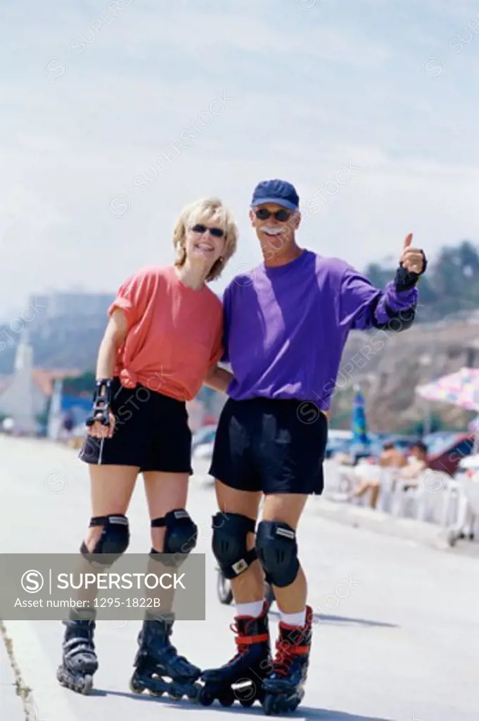 Portrait of a senior couple wearing roller blades